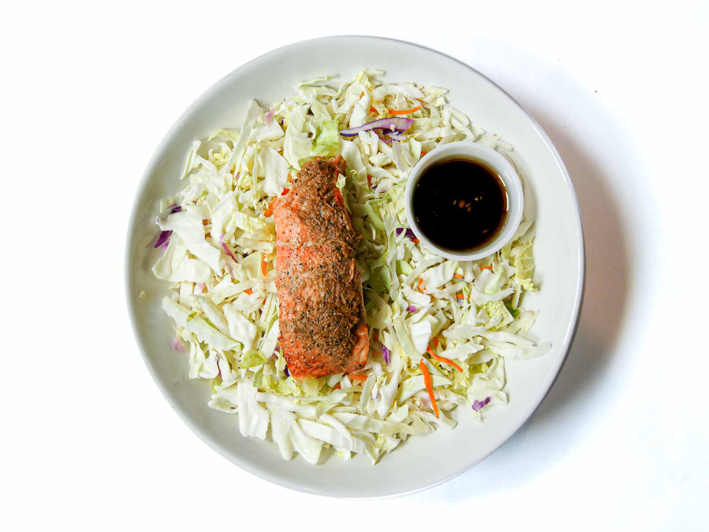 Asian Box's Lemongrass Salmon Salad features grilled salmon, pickled veggies, sprouts, crispy shallots; enhanced by zesty ginger-citrus soy vinaigrette.