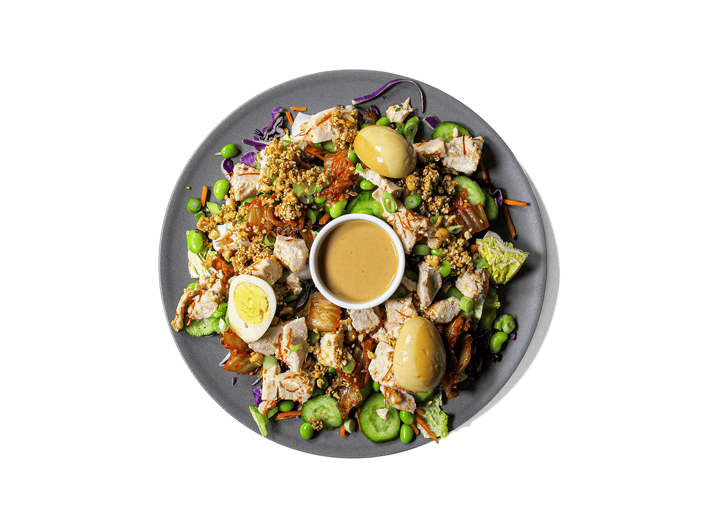 A bold, refreshing bowl packed with tangy kimchi, crisp cucumbers, and protein-rich sous vide chicken tossed with Korean chili threads. Layered with edamame, vibrant veggies, and a marinated soy egg, then finished with a creamy cashew dressing and a crunchy peanut-sesame topping. High in protein, full of probiotics, and rich in healthy fats—crafted for flavor and longevity.