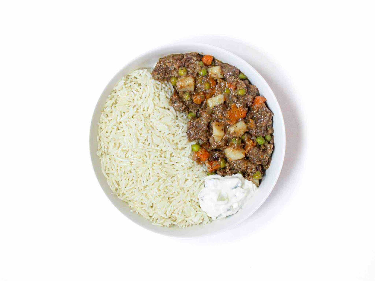 Soupchu's Beef Stew is a hearty dish featuring tended, slow-cooked beef, potatoes, carrots, and peas. Served with rice and complemented by a side of refreshing tzatziki.