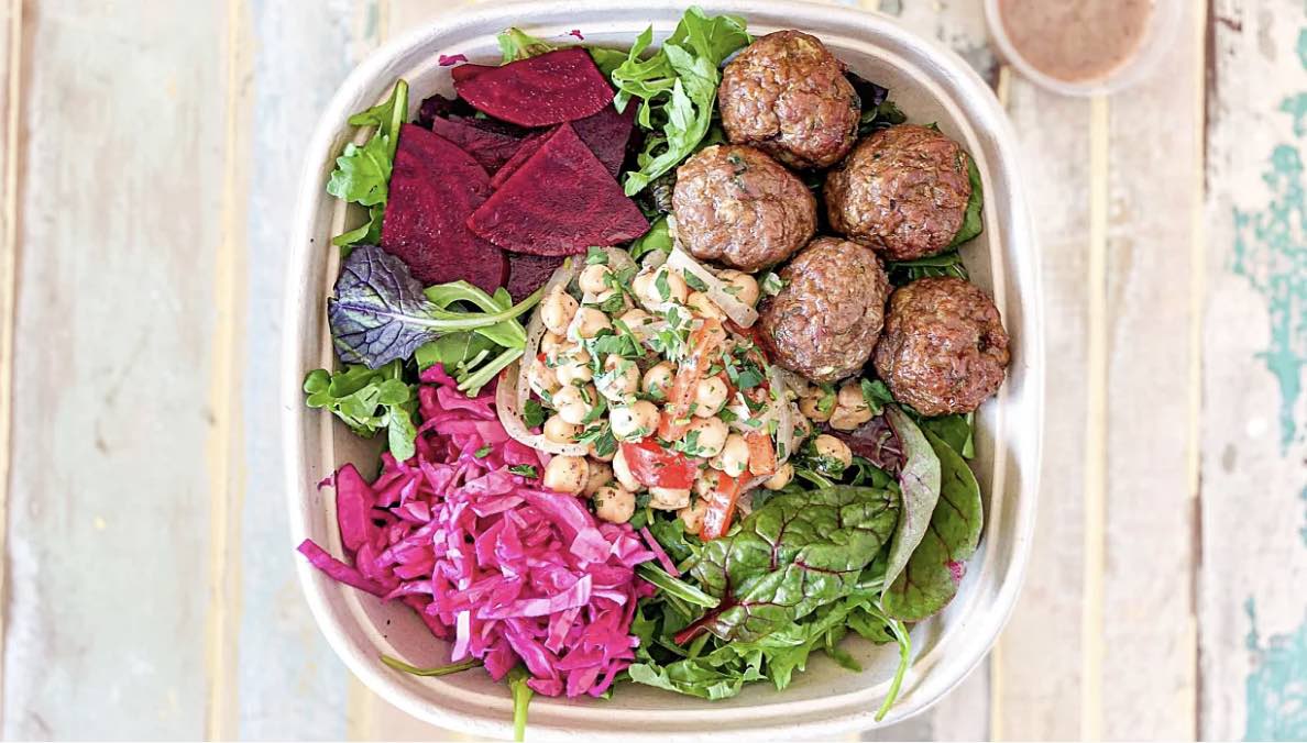 Sumac's Turkish Kofte Salad features tender, spiced Turkish meatballs served on a bed of fresh greens, accompanied by chickpeas and drizzled with tangy sumac vinaigrette. This dish offers a flavorful blend of savory, earthy, and zesty notes, creating a hearty and refreshing Mediterranean meal.