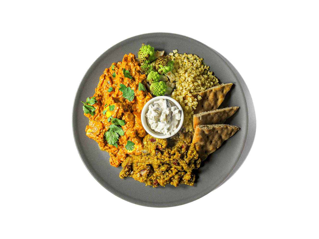 A vibrant, protein-rich medley featuring oven-roasted paneer tikka in a creamy, spiced tomato sauce, paired with earthy dal makhani, fluffy brown turmeric basmati rice, whole wheat pita, roasted cauliflower, and a cooling side of raita. Topped with fresh cilantro, this meal balances bold flavor with nourishing ingredients to fuel longevity and support gut health.