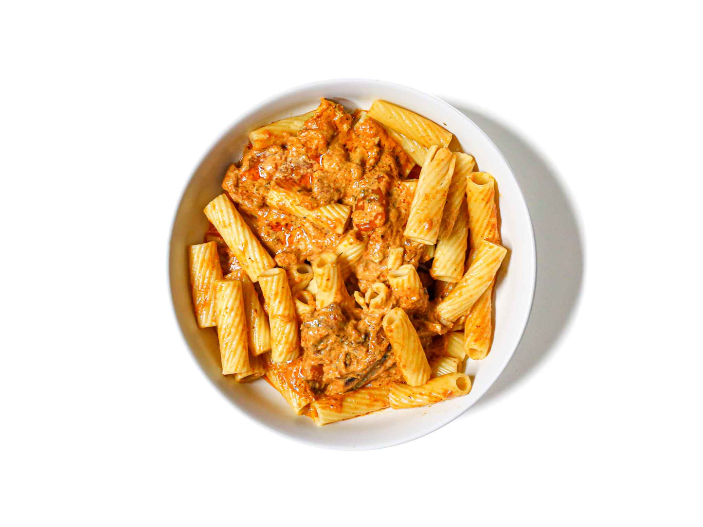 Tenderleaf's Tikka Masala Pasta features al dente rigatoni pasta tossed in a rich, creamy tikka masala sauce. This dish combines the comforting textures of pasta with the bold, aromatic flavors of Indian spices, creating a unique and satisfying fusion meal.