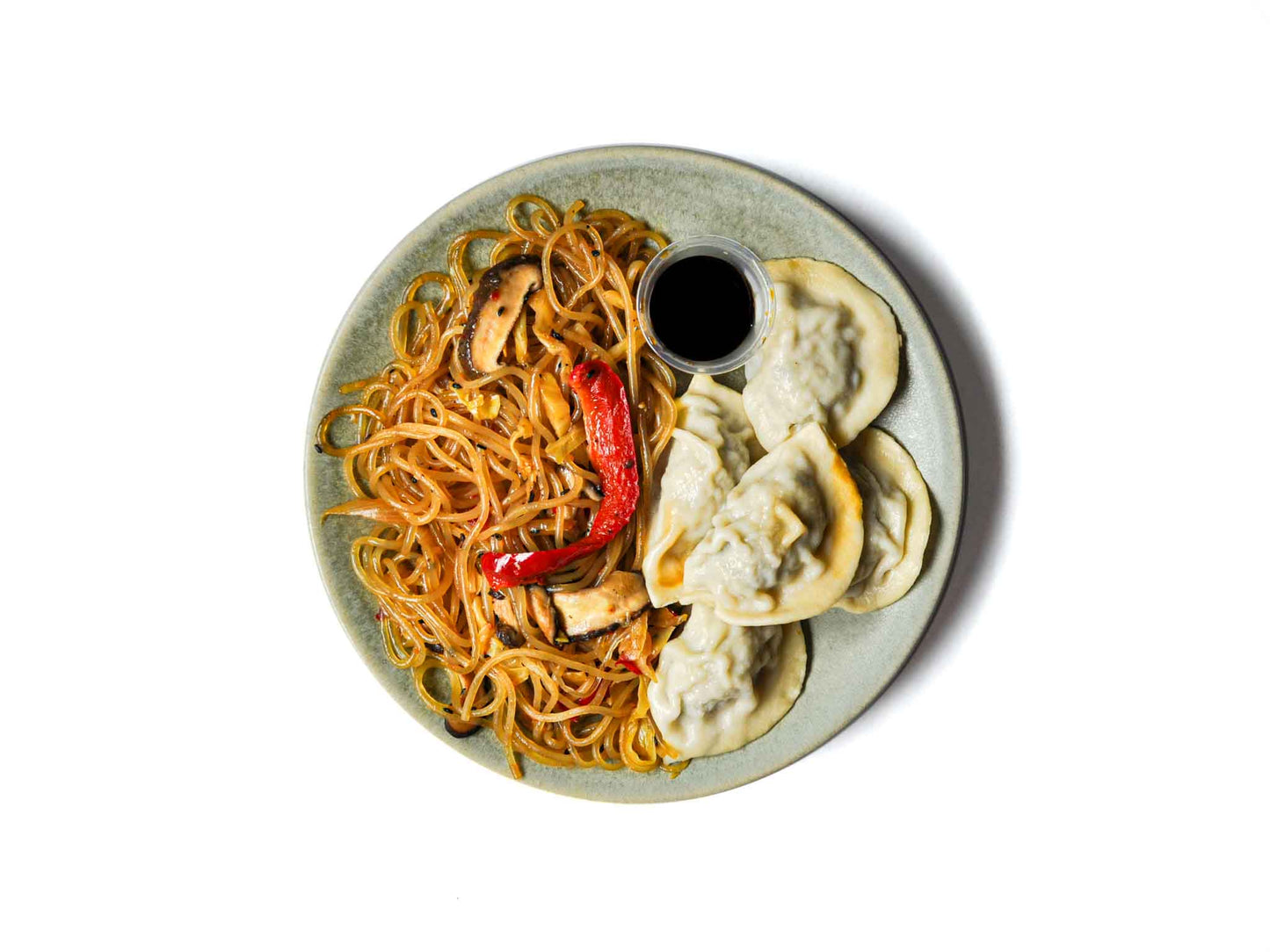 Koi Palace's Peking Dumplings are filled with a savory mix of seasoned pork, served with tender egg noodles and fresh vegetables. This dish provides a delightful combination of rich flavors and satisfying textures, perfect for a comforting meal.