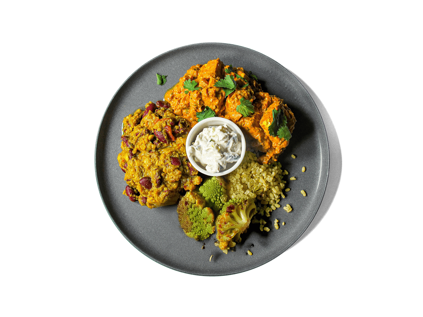 A vibrant, protein-rich medley featuring oven-roasted paneer tikka in a creamy, spiced tomato sauce, paired with earthy dal makhani, fluffy brown turmeric basmati rice, roasted cauliflower, and a cooling side of raita. Topped with fresh cilantro, this meal balances bold flavor with nourishing ingredients to fuel longevity and support gut health.