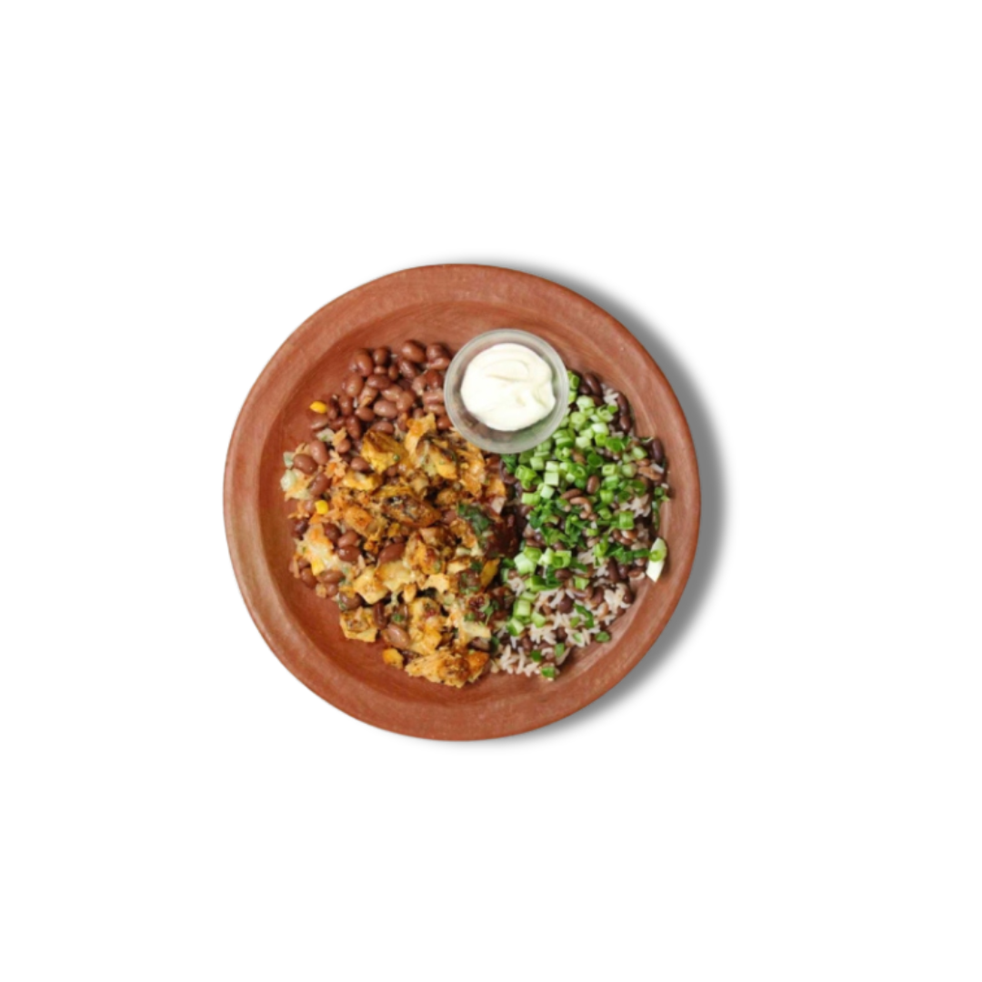 Comal's Mexican Style Grilled Chicken Bowl: Flavorful chicken, red rice, pinquito beans, and cheese topped with chipotle salsa, crema, onion, and cilantro. Perfect for a quick and easy dinner.