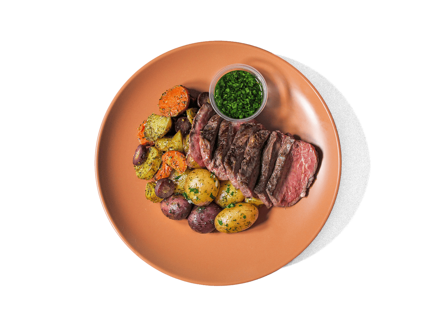 Tender, juicy steak served alongside heirloom marble potatoes. Accompanied by roasted carrots, and a fresh chimichurri, this hearty dish delivers bold flavors and a perfect balance of rich, savory notes and vibrant herbal freshness.