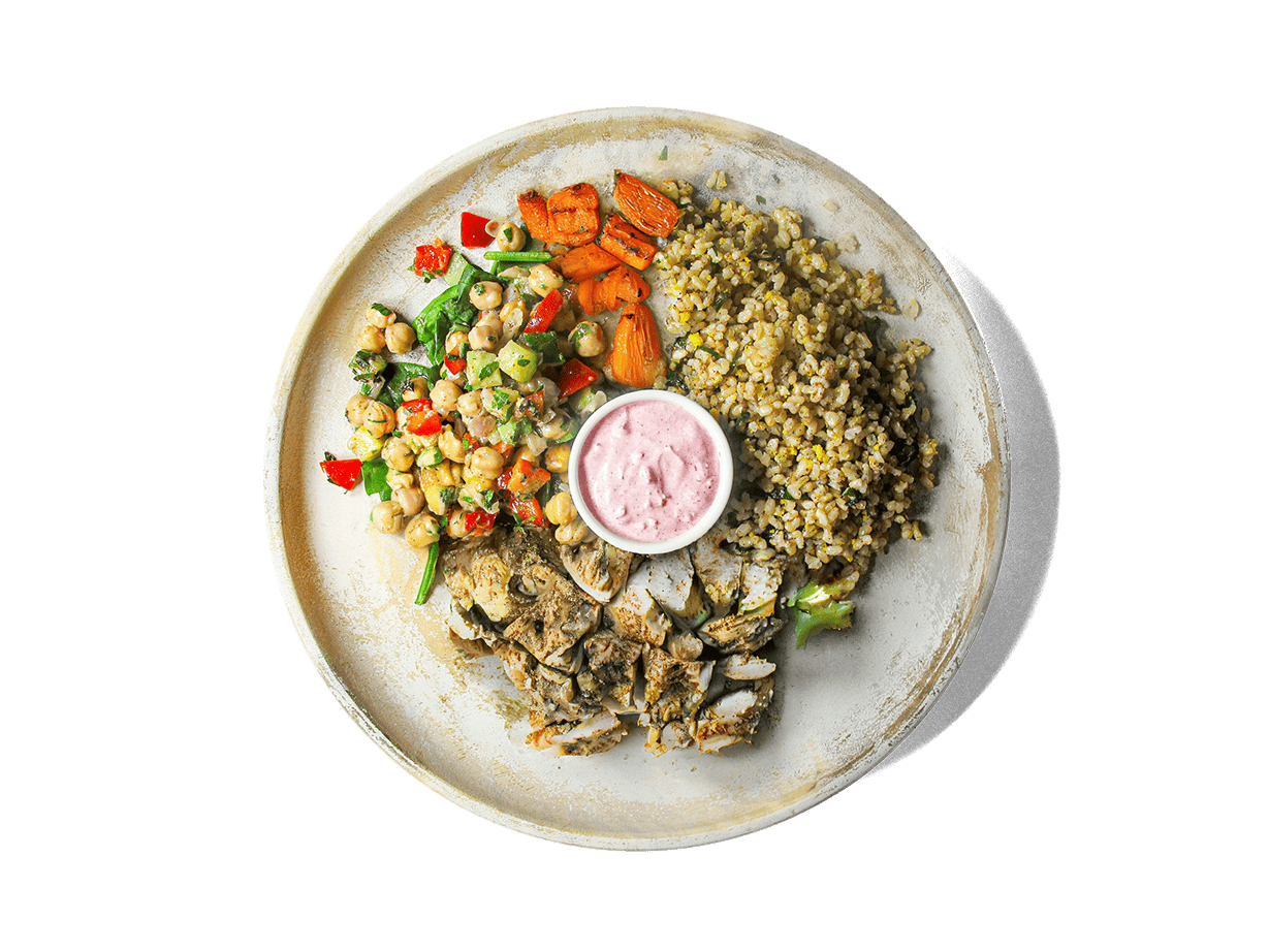 Tender grilled chicken thighs seasoned with sumac, cumin, and lemon rest over aromatic basmati brown rice with orange and basil. Served alongside roasted sumac carrots, zesty chickpea salad, and a swirl of vibrant pink labneh, this bowl bursts with Mediterranean flavors and delivers protein, fiber, and antioxidants to fuel longevity and well-being.