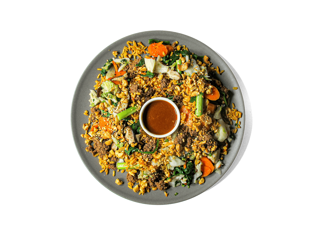 A bold, high-protein bowl featuring savory-sweet ground beef bulgogi over bone broth brown basmati rice, layered with steamed spinach, crisp cucumbers, and lightly pickled kimchi. Finished with a chili garlic sauce kick, a soft-cooked egg, and a cashew sesame crunch for texture. Packed with antioxidants, healthy fats, and gut-friendly ferments—crafted for flavor and longevity.