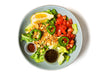 Burma Love's Tea Leaf Salad is a fan favorite! Made with a flavorful mix of crunchy fried garlic, peanuts, sunflower seeds, and roasted sesame. With a hint of sweetness and acidity from fresh lemon and tomatoes. Perfect as a light meal or side dish.