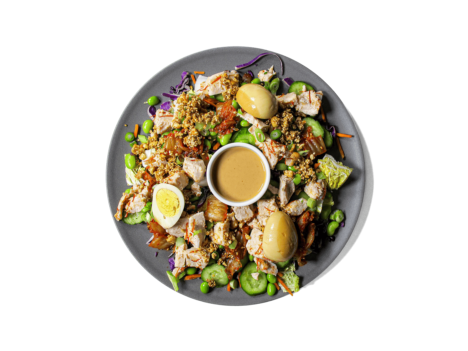 A bold, refreshing bowl packed with tangy kimchi, crisp cucumbers, and protein-rich sous vide chicken tossed with Korean chili threads. Layered with edamame, vibrant veggies, and a marinated soy egg, then finished with a creamy cashew dressing and a crunchy peanut-sesame topping. High in protein, full of probiotics, and rich in healthy fats—crafted for flavor and longevity.