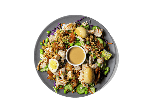 A bold, refreshing bowl packed with tangy kimchi, crisp cucumbers, and protein-rich sous vide chicken tossed with Korean chili threads. Layered with edamame, vibrant veggies, and a marinated soy egg, then finished with a creamy cashew dressing and a crunchy peanut-sesame topping. High in protein, full of probiotics, and rich in healthy fats—crafted for flavor and longevity.