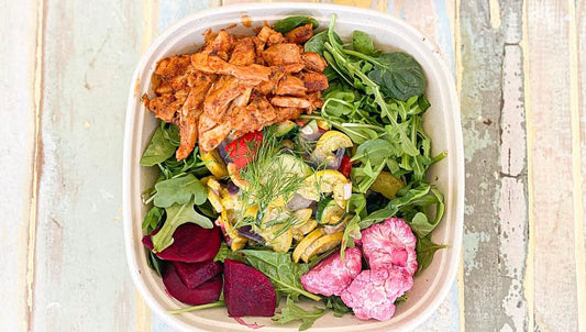 Sumac's Turkish Chicken Salad features marinated organic chicken thighs, roasted seasonal veggies, and pickled beets on a bed of fresh baby spinach topped with sumac vinaigrette. 