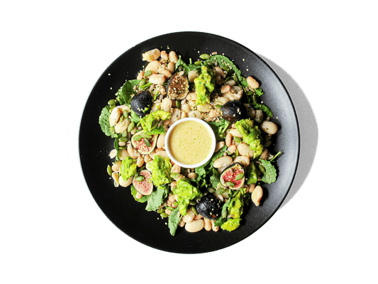 A vibrant, nutrient-dense blend of baby kale, creamy avocado, shredded pasture raised egg, and sweet figs, tossed with a protein-packed white bean medley and zesty lemon vinaigrette. Finished with a crunchy mix of pumpkin, sunflower, and hemp seeds for sustained energy and essential fats