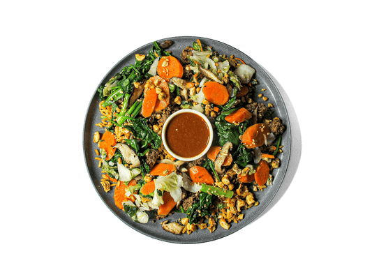 A bold, high-protein bowl featuring savory-sweet ground beef bulgogi over bone broth brown basmati rice, layered with steamed spinach, crisp cucumbers, and lightly pickled kimchi. Finished with a chili garlic sauce kick, a soft-cooked egg, and a cashew sesame crunch for texture. Packed with antioxidants, healthy fats, and gut-friendly ferments—crafted for flavor and longevity.