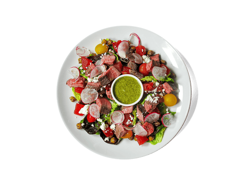 Tender grass-fed flank steak meets juicy compressed watermelon, roasted chickpeas, heirloom tomatoes, and radish, all tossed in a bright cucumber mint vinaigrette. Finished with sheep’s milk feta and crisp greens, this vibrant dish is rich in protein, antioxidants, and heart-healthy fats—designed to fuel strength and longevity.
