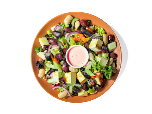 This plant-powered take on the classic Waldorf features crisp apples, heirloom beans, red grapes, celery, and shaved red onion over a bed of super greens. Roasted tofu adds clean, satisfying protein, while a crunchy pumpkin walnut brittle and creamy blood orange dressing bring balance and bold flavor. Packed with fiber, plant protein, and antioxidants to support energy, gut health, and longevity.