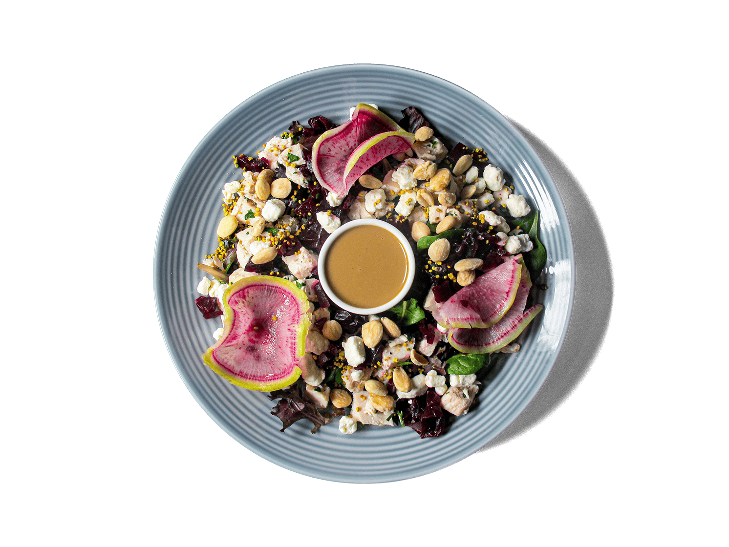 Tender chicken breast with creamy goat cheese, roasted beets, and crunchy almonds, all served on a bed of fresh spring mix. Finished with a hint of bee pollen for a unique touch, this salad offers a vibrant, nutrient-rich blend of flavors and textures.