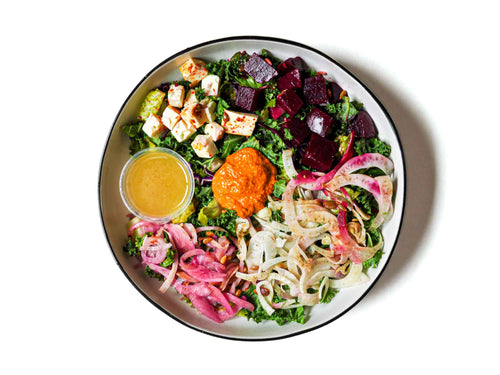 Saucy Green's Muhammara Beet Salad is a fusion of flavors and textures. It combines earthy beets and Muhammara spread topped with walnuts, red bell peppers, and pomegranate molasses. 