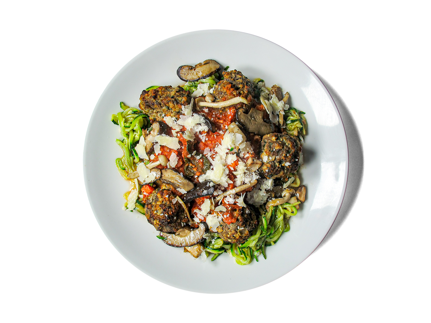 Tender, protein-rich meatballs made from pasture-raised beef and hemp seeds, simmered in a rich Sunday Gravy with Italian sausage and San Marzano tomatoes. Served over a balanced duo of whole wheat spaghetti and zucchini noodles, topped with aged Grana Padano. Comes with a vibrant Super Greens Caesar salad boosted with chickpeas and hemp seeds for an extra hit of plant-based power. A hearty, longevity-focused twist on a classic Italian favorite.