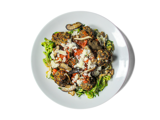 Tender, protein-rich meatballs made from pasture-raised beef and hemp seeds, simmered in a rich Sunday Gravy with Italian sausage and San Marzano tomatoes. Served over a balanced duo of whole wheat spaghetti and zucchini noodles, topped with aged Grana Padano. Comes with a vibrant Super Greens Caesar salad boosted with chickpeas and hemp seeds for an extra hit of plant-based power. A hearty, longevity-focused twist on a classic Italian favorite.