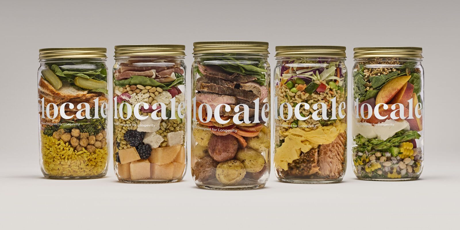 A lineup of five Locale meals in glass jars